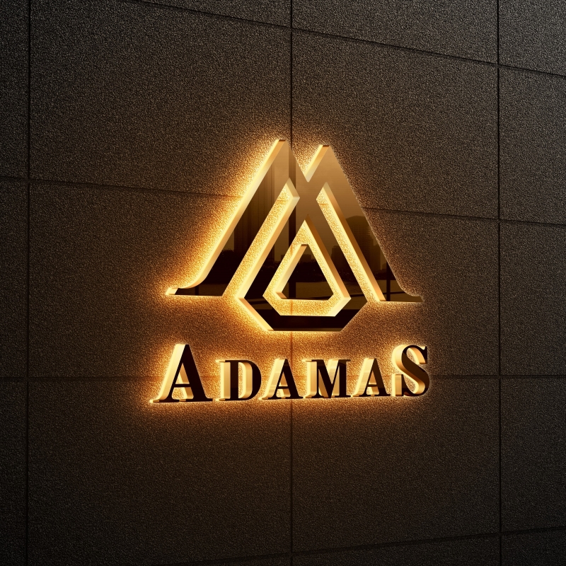 Illuminated signage featuring the word "adamas" in a stylish design