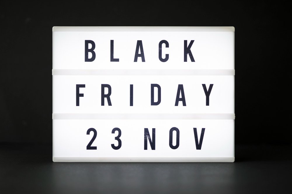 Acrylic signs displaying 'Black Friday 23 Nov' in bold black letters on a white background